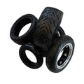 Replacement tires for electric scooters in black rubber with treaded design